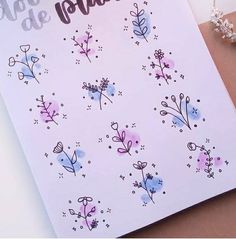 a close up of a card with flowers on it and the words happy valentine written in spanish