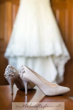 the bride's wedding dress and shoes are on display