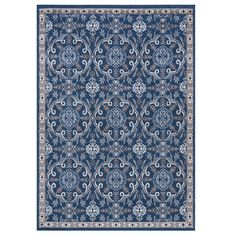 a blue rug with an ornate design on the front and back side, in various colors