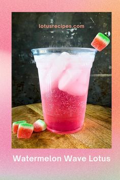 watermelon wave lotus juice in a glass with ice cubes on the side