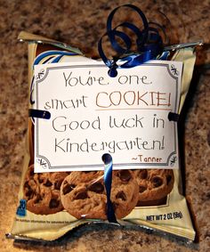 a bag of cookies with a sign on it that says you're one sweet cookie good luck in kindergartsten