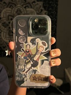 a woman holding up her phone case with an image on it