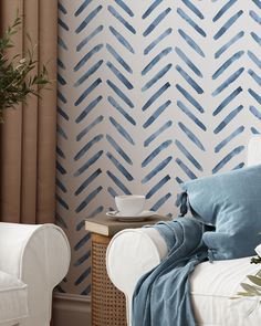 a living room with blue and white wallpaper