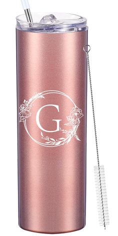 a pink tumbler with a straw in it and a monogrammed g on the side