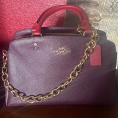 Boysenberry Colorsold Out. This Bag Is Gorgeous. The Color Combination Is Beautiful. In Great Condition, Comes With Dustbag And Crossbody Strap. Does Not Include Chain Purple Crossbody Satchel With Gold-tone Hardware, Classic Purple Bag With Detachable Handle, Burgundy Satchel With Gold-tone Hardware, Burgundy Top Handle Shoulder Bag With Branded Hardware, Coach Purple Evening Bag, Burgundy Tote Satchel With Gold-tone Hardware, Burgundy Satchel Tote With Gold-tone Hardware, Burgundy Rectangular Satchel With Branded Hardware, Luxury Burgundy Coach Bag