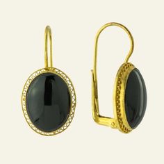 Sensual minimalism. This bold Victorian design features a black onyx stone in a classic 24k vermeil gold open work setting. European backs for pierced ears. Size: 1 1/4 inch. Modern Cabochon Earrings For Formal Occasions, Classic Gold Onyx Jewelry, Oval Evening Earrings, Classic Brass Jewelry With Cabochon, Black Gold-plated Earrings, Black Gold-plated Pierced Earrings, Luxury Black Filigree Jewelry, Elegant Oval Black Enamel Jewelry, Black Gold-plated Drop Earrings