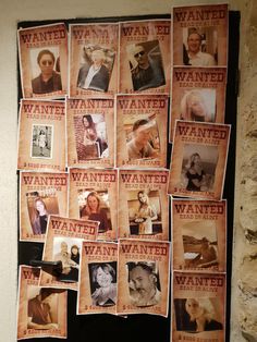 a bunch of wanted posters on a wall