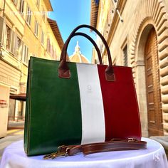 This bag has been made of the best genuine leather by local master crafters of Florence in Italy, designed for women who only accept premium Italian quality and luxury leather bags and modern Italian fashion. . . . Sizes: Width: 40 cm / 15.75 inches Height: 30 cm / 11.81 inches Depth: 11 cm / 4.4 inches The Story of this bag :  In the picturesque streets of Italy, where art and craftsmanship thrive, a story unfolds about a remarkable handmade leather bag that captures the essence of timeless beauty. This Italy leather bag is more than just an accessory; it is a masterpiece crafted with love and devotion by skilled artisans. As you hold this shoulder Italian bag in your hands, you can feel the passion and dedication that went into its creation. Each stitch, each fold, and every detail is me Italian Leather Bag As Gift, Italian Leather Bag As A Gift, Leather Tote Laptop Bag Gift, Luxury Leather Briefcase As Gift, Luxury Leather-lined Briefcase For Gift, Elegant Leather Briefcase For Gift, Luxury Leather-lined Briefcase As A Gift, Green Rectangular Leather Briefcase, Green Leather Shoulder Bag Briefcase