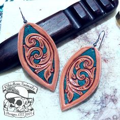 "\"Awaken\" hand tooled leather earrings with turquoise color accent, hypoallergenic ear wires" Welding Hoods, Diy Leather Projects, Leather Tooling Patterns, Tooling Patterns, Leather Jewellery, Leather Diy Crafts, Custom Patches, Hand Tooled Leather, Leather Projects