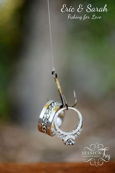 an image of a fishing hook and ring ornament on a cell phone screen