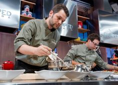 two chefs in the kitchen preparing food