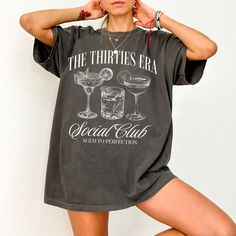 Celebrate your 30s in style with our fun and trendy "The Thirties Era" Social Club Cocktail t-shirt! Perfect for a milestone birthday, this trendy tee is designed to capture the spirit of turning 30! DETAILS * Comfort Colors Garment-Dyed Heavyweight T-Shirt * 100% ring spun cotton * Design is printed using DTG technology which uses high-quality water-based inks that are printed directly into the fabric. This means that there may be a slightly faded/vintage look to the design depending on the color and fabric of the garment. SIZING * These unisex T-shirts are true-to-size with a relaxed fit. * Most women find their typical size works best since they are meant to be a bit loose fitting. * Some women size down for a tighter fit. * If you would like a more oversized look, we recommend sizing u Martini Party, Raccoon Shirt, Bar Crawl, Pepper Color, Comfort Colors Tshirt, Outfit Vintage, Dirty Martini, Future Mrs, Retro Humor