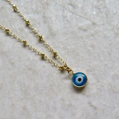 "Crescent Moon Necklace~ Pretty moon and star circle disk charm with cubic zirconia dangles from 14k gold fill satellite chain. Great for layering with our other necklaces! Necklace 18\" SHOP~ http://www.etsy.com/shop/HanaMauiCreations?ref=si_shop International buyers please read our shipping policies before ordering~ POLICIES~ https://www.etsy.com/shop/HanaMauiCreations/policy?ref=shopinfo_policies_leftnav" Dainty Gold Plated Nickel-free Charm Necklaces, Gold Dainty Evil Eye Charm Necklace, Adjustable Round Gold Charm Necklaces, Adjustable 14k Gold Filled Charm Necklaces, Spiritual Charm Necklaces With Adjustable Chain, Adjustable Round Charm Necklace In 14k Gold Filled, Spiritual Charm Necklace With Adjustable Chain, Adjustable Round 14k Gold Filled Charm Necklace, Handmade 14k Gold Filled Round Charm Necklaces