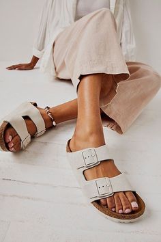 **Fit:** Narrow: A-B Width Classic two-strap Birkenstock with fully adjustable straps. Thick and supple oiled leather upper with an ultra-comfortable super soft footbed. A Birkenstock narrow width fit is comparable to a Medium (B Width). | Arizona Soft Footbed Birkenstock Sandals at Free People in White, Size: EU 36 Shoe Image, Birkenstock Sandals, St George, Boho Clothing, Boho Outfits, Birkenstock, Arizona, Adjustable Straps, Leather Upper