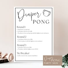 a paper pong party sign next to some hair dryers on a counter top