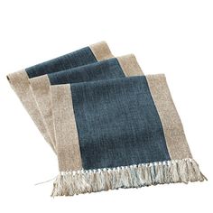 three pieces of blue and beige linen with fringes