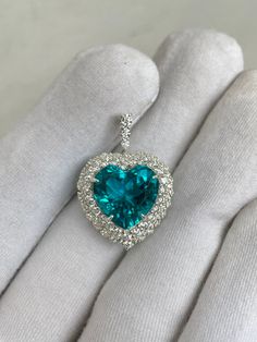 Premium Paraiba Pendant, Double Halo Pendant, Vintage Paraiba Jewelry, 14k Solid Gold, Wedding Pendant, Bridal Pendant, Engagement Pendant  Handmade ring. Stone : Lab Paraiba Tourmaline Gemstone Cut : Heart Cut Stone Size : 10mm×10mm Side Stone : Cubic Zirconia Metal  : 14k Gold / 925 Silver Plating:  Platinum Plated , Rose Gold Plated , Gold Plated. Personalization:10K/14K/24K/GOLD/SILVER/PLATINUM/ROSE-GOLD/WHITE GOLD. (Contact me)  All items come in a beautiful jewelry box.  Since all out Jewelry is Handmade with care and love, It takes [6-8 Business Days] to make the item. Once the item is made: Standard Shipping: 1-3 Weeks Express Shipping: 4-12 Days.  If you need anything personalized then you are MOST WELCOME. We specialized in personalized jewelry of all kinds, We have All Gemstones Paraba Jewelry, Paraiba Ring, Luxury Blue Teardrop Pendant Jewelry, Paraiba Tourmaline Gemstone, Luxury Pear-shaped Tourmaline Jewelry, Paraiba Tourmaline Necklace, Paraiba Tourmaline Ring, Bridal Pendant, Paraiba Tourmaline