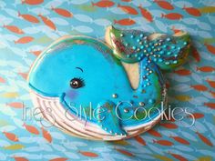 a decorated cookie with a blue whale on it