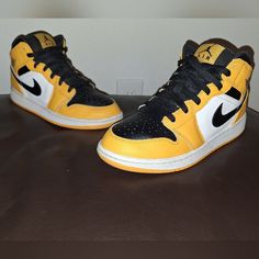 Nike Air Jordan 1 Mid Taxi. Black Yellow. Size 6.5y. See Pics For Details. ***Box Not Included*** Nike Air Jordan 1 Taxi, Air Jordan 1 Mid Taxi, Jordan 1 Mid Taxi, Nike Air Jordan 1 Mid, Nike Air Jordan 1, Kids Jordans, Air Jordan 1 Mid, Jordan 1 Mid, Air Jordan 1