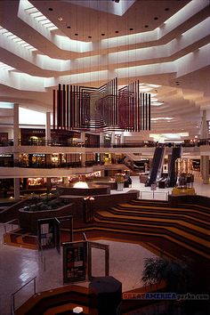 the inside of an airport with many people