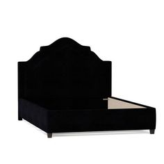 the bed frame is black and has an upholstered headboard