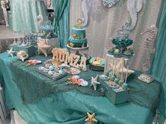 the table is set up for an ocean themed party