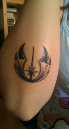 a woman with a star wars tattoo on her arm