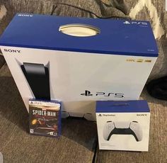 the box for the playstation 4 console is next to it's packaging and accessories