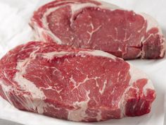 a piece of raw meat is shown on a white background with clippings to the side