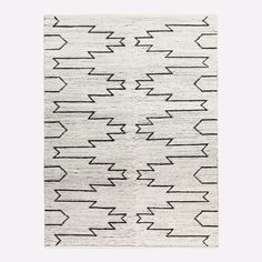 a black and white rug with arrows on it