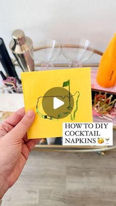 someone holding up a card with the words how to diy cocktail napkins on it