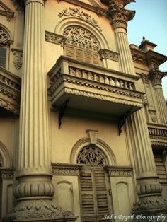 an old building with columns and windows