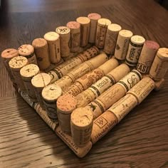 a bunch of wine corks sitting on top of a wooden table