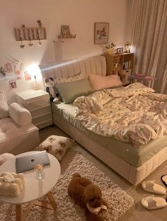 a bed room with a neatly made bed and two teddy bears on the rugs