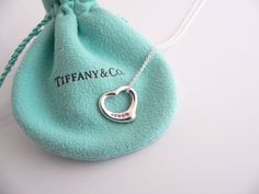 Overview:Offered for sale is a gorgeous and wonderful Tiffany classic. Whether you are just starting your Tiffany collection or are thinking of adding another piece, this one is perfect for you. Tiffany & Co. & Elsa Peretti’s Silver and 5 Pink Sapphires Open heart necklace is a Tiffany classic that will never go out of style. Perfect way to say “I love you :)”... Believe me, she will know ... It will most certainly be a piece that you will turn to over and over again, so it is great value for yo Luxury Necklace For Valentine's Day, Designer High-quality Necklaces For Gift, Elegant Heart Pendant Necklace With Hallmarks, Designer Engraved Necklace For Gift, Elegant Pink Engraved Necklace, Designer Sterling Silver Necklace Gift, Designer Sterling Silver Necklace For Gift, Luxury White Gold Necklace For Anniversary Gift, Luxury Necklaces For Gifts