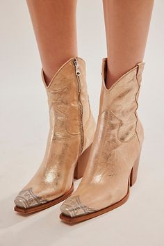 Gorgeous Italian-crafted leather boots featured in a western-inspired style with an etched metal toe, slim sit and stacked heel. * Side zipper closure * Cushioned insole * Curved top **Fit Note:** This style runs small. If between sizes, we suggest sizing up. | Brayden Western Boots by FP Collection at Free People in Gold, Size: EU 38 Free People Brayden Western Boots, Cowgirl Booties Outfits, Gold Western Boots, Cowgirl Dresses With Boots, Dress And Cowgirl Boots, Bride Boots, Booties Outfit Fall, Womens Fall Boots, Fringe Cowboy Boots