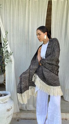 ☝ 100% Llama Wool  ✂ Dimensions: 27.5" x 70.8" inches  ▓ Unisex Argentine Shawl  ✔ Due to being handmade products, there may be slight variations in colors, designs, and measurements between one product and another.    ★ Discover the essence of the Patagonian Andes at Pampa Root, where tradition meets timeless elegance. Our high-quality ponchos and ruanas are meticulously handwoven with noble fibers sourced from the heart of the Andes, using time-honored traditional looms.  ☀ Ancient weaving techniques breathe life into each unique piece, transcending fashion to embody luxury and sustainability. We proudly uphold the cultural heritage of Andean communities, ensuring a triple impact - social, environmental, and economic.  ☝ Our commitment to sustainability extends to using natural dyes, cap Luxury Wool Shawl Cape, Luxury Handmade Shawl As A Gift, Traditional Woven Shawl For Fall, Traditional Woven Winter Shawl, Handwoven Artisan Shawl For Fall, Bohemian Alpaca Wrap One Size, Bohemian Alpaca Wraps One Size, Handwoven Folk Shawl One Size, Folk Style Handwoven Shawl