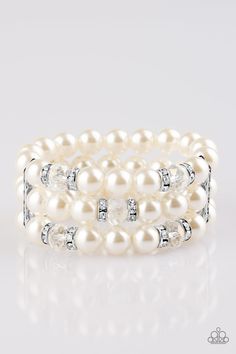 Pinched between white rhinestone encrusted frames, white rhinestone encrusted rings, crystal-beads, and white pearls are threaded along elastic stretchy bands for a glamorous look. Sold as one individual bracelet. P9RE-WTXX-230XX White Pearl Bracelet, Glamorous Look, White Bracelet, White Bracelets, Paparazzi Accessories, Stretchy Bracelets, White Rhinestone, Rhinestone Bracelet, Paparazzi Jewelry