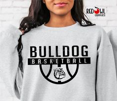 Personalized Bulldog School Spirit T-Shirt Crewneck, Hoodie Hooded Sweatshirt Football, Baseball, Basketball, Softball, Track, Volleyball, Cross Country, Cheer, Wrestling Not all colors are available in all sizes and styles.  Please check the color and size charts in photos. We do our best to accurately represent shirt colors by using actual photos but do understand that all monitors will display differently. Please contact us prior to purchase with any questions on sizing or colors. Your purchase includes a custom imprint created specifically for your team! A product proof will be emailed to you within 1 business day.  Please keep an eye on your Etsy messages and reply with any changes within 24 hours. Your order will be sent to production after that time if no response is received. Exces Pep Club, Represent Shirt, Basketball Sweatshirts, Bulldog Shirt, Basketball T Shirt, Basketball Shirts, Grey Shirt