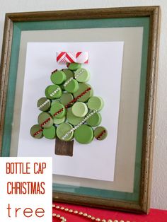 a bottle cap christmas tree made out of wine corks is displayed in a frame