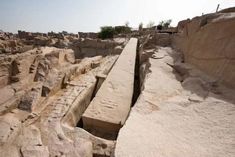 an ancient city is built into the rocks and has been dug in to it's sides