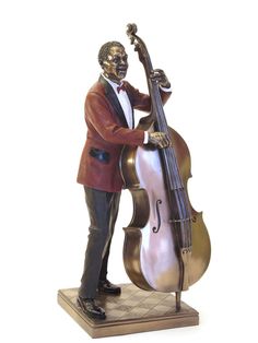 a statue of a man with a cello in his hand and wearing a red jacket