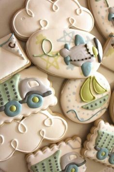 decorated cookies are arranged in the shape of baby carriages and strollers on top of each other