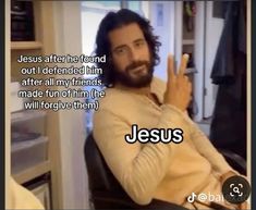 a man sitting in a chair making the peace sign with his hand and saying jesus after he found out i defended him after all my friends made fun