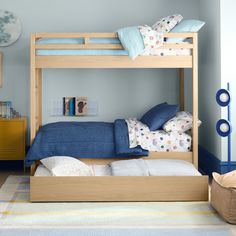 the bunk bed is made up and ready to be used as a child's room