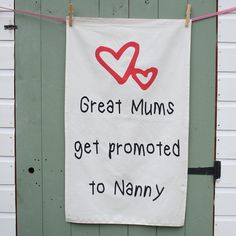 a white sign hanging on the side of a door that says great mums get promote to nanny