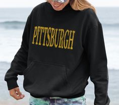 Vintage Pittsburgh Gift, Pittsburgh Shirt, Pittsburgh Football Hoodie, Pittsburgh Souvenir, University Shirt, Pittsburgh Sweatshirt * 50% cotton, 50% polyester * Medium-heavy fabric (8.0 oz/yd² (271.25 g/m * Double-lined hood * Double-needle stitching throughout * Air-jet spun yarn with a soft feel and reduced pilling * 1x1 athletic rib knit cuffs and waistband with spandex * Front pouch pocket PROPER SIZING Please see photos to see a specific sizing chart for this shirt style. These shirts are unisex size, meaning they are not women's fitted shirts. If would like a more fitted look, we suggest that you size down. To get your size, lay your favorite shirt at home flat, measure armpit to armpit, and then compare to the size chart in the photos. CARE INSTRUCTIONS Machine wash cold, inside-ou College Cotton Hoodie With Screen Print, Cotton College Hoodie With Screen Print, Cotton Hoodie With Screen Print For College, Cotton School Spirit Hoodie For Fans, Pre-shrunk Cotton Hoodie For Fan Merchandise, Pre-shrunk Relaxed Fit Hoodie For Fans, Graphic Print Hoodie For School Spirit Streetwear, Pittsburgh Sweatshirt, Gameday Fashion