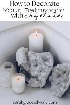 a candle and some rocks in a bathtub with the words how to decorate your bathroom with crystals