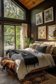 a large bed sitting in a bedroom next to two windows