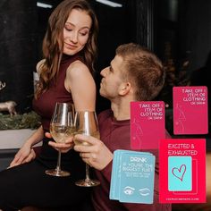 a man and woman sitting next to each other holding wine glasses